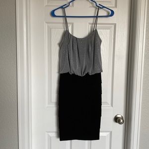 Womens grey dress with sparkles and black ruffled waist